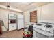 Kitchen space featuring white appliances including a stove, refrigerator and a red microwave at 1438 S 112Th Ave, Avondale, AZ 85323