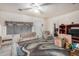 Cozy living room with carpet, ceiling fan, and large window at 1438 S 112Th Ave, Avondale, AZ 85323