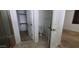 Bathroom featuring double sinks, a large shower with glass door, and a separate toilet area at 15424 N 22Nd Ln, Phoenix, AZ 85023