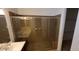 Modern bathroom with a tiled shower enclosure and dual sink vanity, enhancing its contemporary style at 15424 N 22Nd Ln, Phoenix, AZ 85023