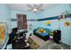 bedroom with blue painted walls, ceiling fan, and window shutters provides a comfy space at 15424 N 22Nd Ln, Phoenix, AZ 85023