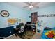 bedroom with ceiling fan, playful decor, and desk area offers a cheerful environment for learning and rest at 15424 N 22Nd Ln, Phoenix, AZ 85023