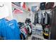 Walk-in closet showcasing organized clothing racks and shelves filled with clothing and accessories at 15424 N 22Nd Ln, Phoenix, AZ 85023