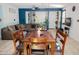 Close up of dining area with access to Gathering room; a dark wooden table with seating for six at 15424 N 22Nd Ln, Phoenix, AZ 85023