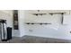 Garage with water filtration system, water heater, and shelving for organized storage at 15424 N 22Nd Ln, Phoenix, AZ 85023