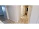 Hallway with tiled floors, leading to several rooms, ensuring easy navigation throughout the home at 15424 N 22Nd Ln, Phoenix, AZ 85023