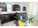 Spacious kitchen with an island, stainless steel appliances, and dark cabinets provides ample space for cooking at 15424 N 22Nd Ln, Phoenix, AZ 85023