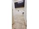 Functional laundry room featuring upper cabinets, tile floors, and readily accessible utility connections at 15424 N 22Nd Ln, Phoenix, AZ 85023