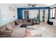 Cozy living room features a sectional sofa, area rug, and custom two-tone paint at 15424 N 22Nd Ln, Phoenix, AZ 85023