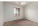 A cozy bedroom featuring a ceiling fan and a window with wooden blinds at 15430 N 19Th Way, Phoenix, AZ 85022