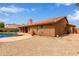 Rear exterior of home showcases a sparkling pool, expansive patio and drought tolerant landscaping at 15430 N 19Th Way, Phoenix, AZ 85022