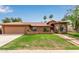 Inviting home featuring a red tile roof, well-manicured lawn, and desert landscaping with mountain views at 15430 N 19Th Way, Phoenix, AZ 85022