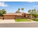 Inviting home featuring a red tile roof, well-manicured lawn, and desert landscaping with mountain views at 15430 N 19Th Way, Phoenix, AZ 85022