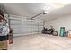 A spacious garage with a motorcycle and various storage items at 15430 N 19Th Way, Phoenix, AZ 85022