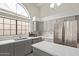Bright kitchen with gray cabinets, stainless steel appliances, and a large window at 15430 N 19Th Way, Phoenix, AZ 85022