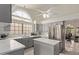 Modern kitchen with stainless steel appliances, grey cabinetry, and quartz countertops at 15430 N 19Th Way, Phoenix, AZ 85022