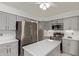 Spacious kitchen features a center island, stainless steel appliances, and ample cabinet space at 15430 N 19Th Way, Phoenix, AZ 85022