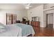 Spacious main bedroom with hardwood floors, a ceiling fan, and a seating area at 15430 N 19Th Way, Phoenix, AZ 85022