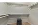 A well-organized walk-in closet with multiple shelves and a safe at 15430 N 19Th Way, Phoenix, AZ 85022