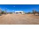 Expansive desert home featuring native landscaping, mountain views and blue skies at 16025 E Rancho Laredo Dr, Scottsdale, AZ 85262