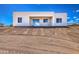 Contemporary home with a covered patio set on a desert landscape at 16025 E Rancho Laredo Dr, Scottsdale, AZ 85262