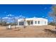Stunning exterior view of modern home with native landscaping and clear blue skies at 16025 E Rancho Laredo Dr, Scottsdale, AZ 85262