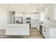 Bright kitchen features marble countertops, stainless appliances, white cabinets, and ample counter space at 16025 E Rancho Laredo Dr, Scottsdale, AZ 85262