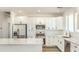 Bright kitchen features marble countertops, stainless appliances, and white cabinets at 16025 E Rancho Laredo Dr, Scottsdale, AZ 85262