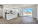 Spacious kitchen with white cabinets, stainless steel appliances, marble countertops, and mountain view at 16025 E Rancho Laredo Dr, Scottsdale, AZ 85262