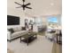 Spacious living room adjacent to an open kitchen with views and access to the yard at 16025 E Rancho Laredo Dr, Scottsdale, AZ 85262