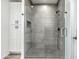 Stylish glass-enclosed shower with gray tile and modern fixtures at 16025 E Rancho Laredo Dr, Scottsdale, AZ 85262