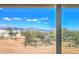 Expansive desert views from inside the home, showcasing mountains and sky at 16025 E Rancho Laredo Dr, Scottsdale, AZ 85262