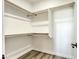Spacious walk-in closet with ample shelving and hanging rods at 16025 E Rancho Laredo Dr, Scottsdale, AZ 85262