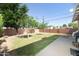 Spacious backyard featuring mature trees and a well-maintained lawn, perfect for outdoor activities at 1650 N 10Th St, Phoenix, AZ 85006