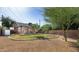 Charming backyard with brick home featuring a grassy area, rock border, and patio area for entertaining at 1650 N 10Th St, Phoenix, AZ 85006