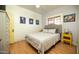 Bedroom with gray, tufted headboard and modern, color-coordinated decor at 1650 N 10Th St, Phoenix, AZ 85006