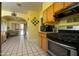Spacious kitchen with stainless steel oven and view of bright sunroom at 1650 N 10Th St, Phoenix, AZ 85006