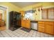 Sunny kitchen featuring stainless steel appliances, wooden cabinets, and tile floors at 1650 N 10Th St, Phoenix, AZ 85006