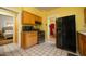 Bright yellow kitchen with stainless steel appliances and tile flooring at 1650 N 10Th St, Phoenix, AZ 85006
