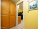 Walkway view of the kitchen featuring a stainless refrigerator and wooden cabinetry at 1650 N 10Th St, Phoenix, AZ 85006