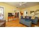 Bright living room with hardwood floors, large couch and entertainment center at 1650 N 10Th St, Phoenix, AZ 85006