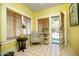 Sunny sunroom with potted plants, neutral walls, and wood-slat blinds at 1650 N 10Th St, Phoenix, AZ 85006