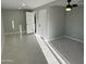 Spacious bedroom with tile flooring, a ceiling fan, and a view of an open door at 1720 W Michigan Ave, Phoenix, AZ 85023