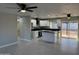 Modern kitchen featuring white cabinets, granite countertops, and an island with a breakfast bar at 1720 W Michigan Ave, Phoenix, AZ 85023
