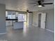 Bright open-concept living room and kitchen area with stylish tile floors and modern ceiling fans at 1720 W Michigan Ave, Phoenix, AZ 85023