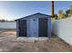 Outdoor shed with dual doors providing storage and utility at 1720 W Michigan Ave, Phoenix, AZ 85023