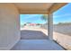 An open back patio overlooks a spacious backyard area, enclosed by a block wall fence at 19365 N Pietra Dr, Maricopa, AZ 85138