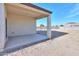 A covered back patio provides shade, overlooking a low maintenance backyard and a block wall fence at 19365 N Pietra Dr, Maricopa, AZ 85138