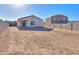 A low maintenance backyard enclosed by block wall fencing, and a covered patio at 19365 N Pietra Dr, Maricopa, AZ 85138