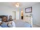 Bedroom with neutral walls, dresser, and decor accents at 19365 N Pietra Dr, Maricopa, AZ 85138